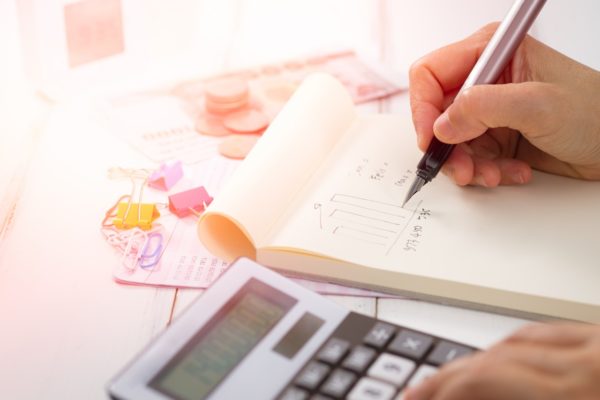 financial paperwork and calculator